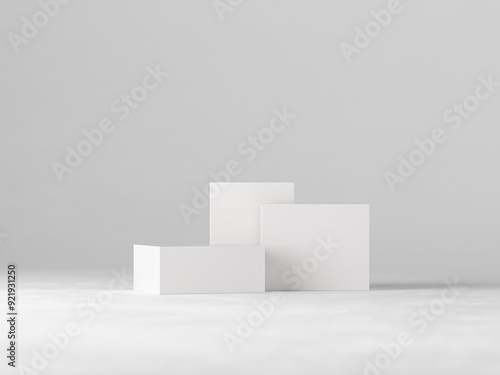 Three blank white boxes of varying sizes arranged on a clean, minimalist background. Perfect for showcasing product packaging designs, branding concepts, or minimalist product displays.