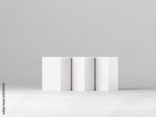 Three blank white boxes of varying sizes arranged on a clean, minimalist background. Perfect for showcasing product packaging designs, branding concepts, or minimalist product displays.