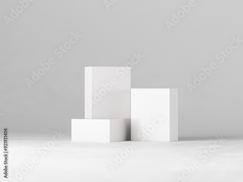 Three blank white boxes of varying sizes arranged on a clean, minimalist background. Perfect for showcasing product packaging designs, branding concepts, or minimalist product displays.