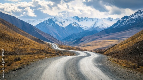 Scenic mountain road with dramatic turns and expansive views of distant peaks. Great for outdoor adventure and travel imagery