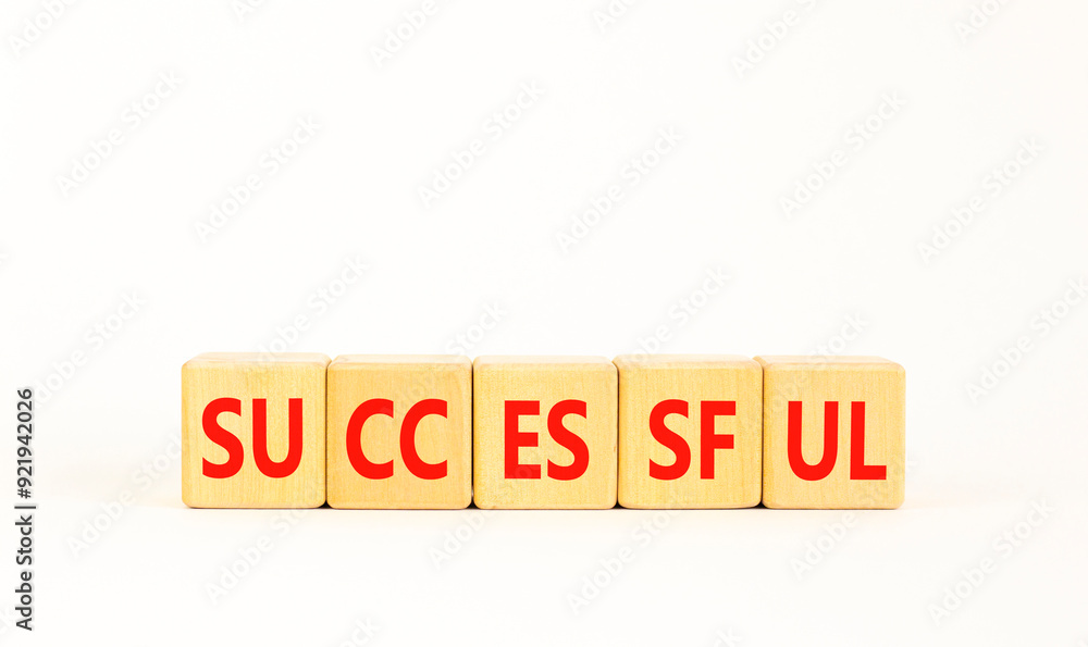 Successful symbol. Concept word Successful on beautiful wooden blocks. Beautiful white background. Business successful concept. Copy space. Successful symbol. Concept word Successful on beautiful wooden blocks. Beautiful white background. Business successful concept. Copy space.