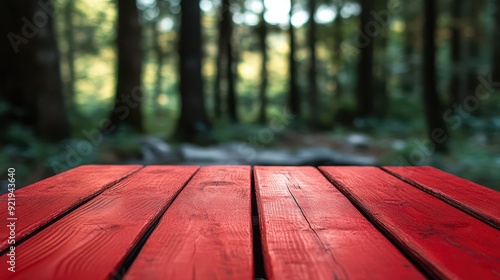 Vibrant red wooden table against a blurred forest backdrop, capturing nature s contrast, wooden table, red, outdoor, rustic atmosphere photo