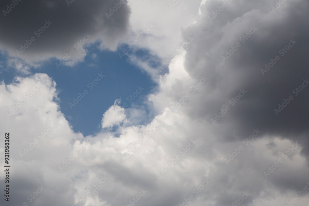 hope concept: blue sky behind rain clouds hope concept: blue sky behind rain clouds