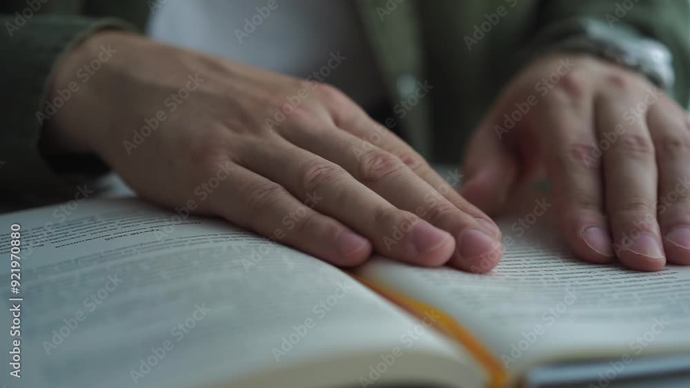 A man is reading a book.
A man sits in the library and reads a book A man is reading a book.
A man sits in the library and reads a book