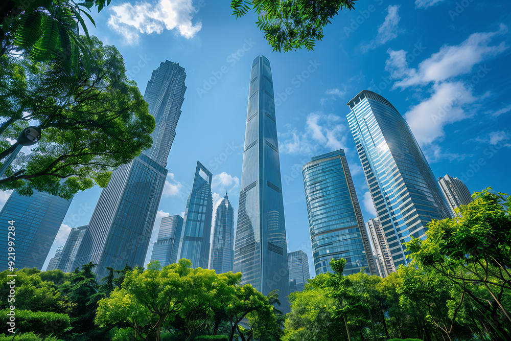 Fototapeta premium Skyscrapers Viewed from Below with Blue Sky and White Clouds