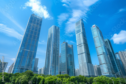 Skyscrapers Viewed from Below with Blue Sky and White Clouds