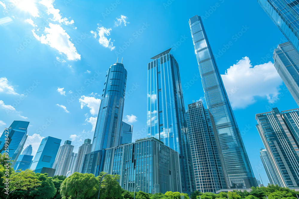 Skyscrapers Viewed from Below with Blue Sky and White Clouds Skyscrapers Viewed from Below with Blue Sky and White Clouds