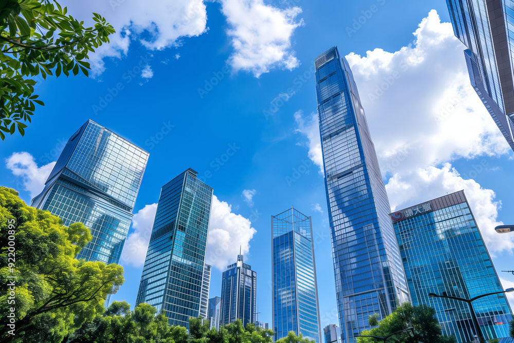 Skyscrapers Viewed from Below with Blue Sky and White Clouds Skyscrapers Viewed from Below with Blue Sky and White Clouds