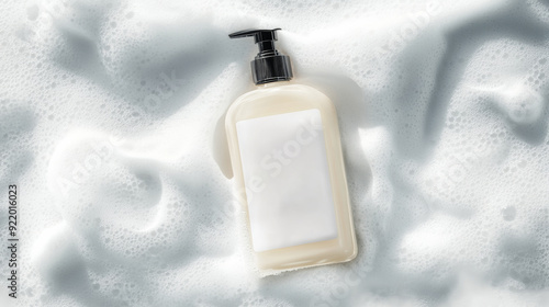 A bottle of cleanser was placed on top of the soft white foam. blank label, no text