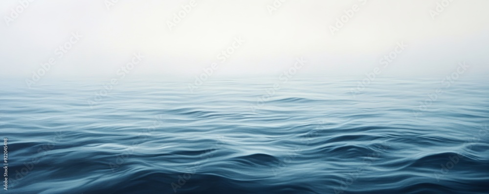 Deep blue ocean waves rolling on a misty day Deep blue ocean waves rolling on a misty day