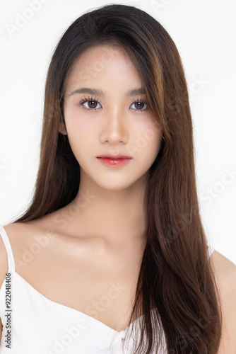 Beautiful young Asian woman with natural beauty make up style shows healthy and perfect skin on isolated background. Facial and skin care concept for commercial advertising.