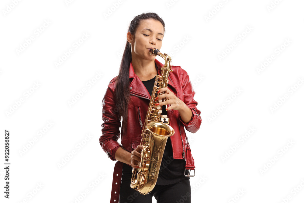 Fototapeta premium Female saxophonist in a red leather jacket playing sax