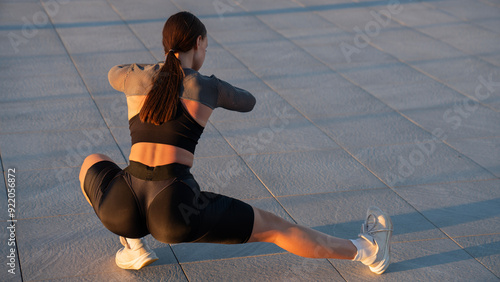 Fitness, city and woman stretching her legs in the street before a cardio workout, running or training