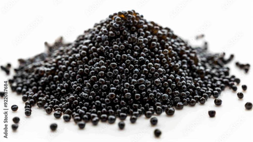 Naklejka premium Close-up image of a pile of black peppercorns for cooking and seasoning use.