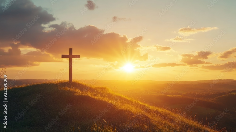 A cross on a hill, with the sun setting behind it, casting a golden glow over the landscape, symbolizing faith and hope. A cross on a hill, with the sun setting behind it, casting a golden glow over the landscape, symbolizing faith and hope.