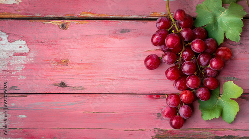  a compelling image of a red grape on an old blue wood table