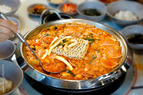 부대찌개에 라면 사리를 넣고 끓이는 모습 photo