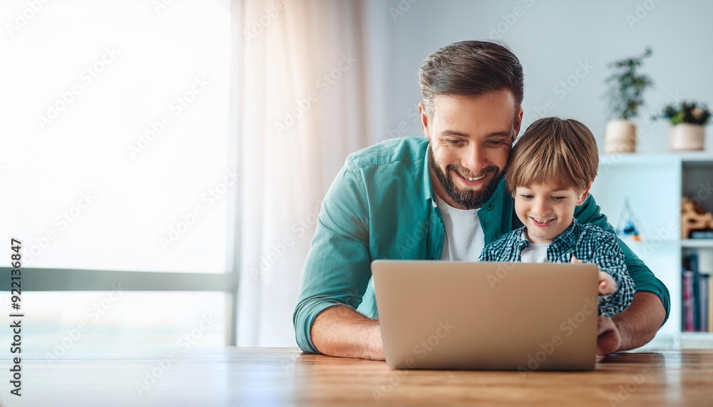 Single dad and son using laptop together happily. Technology and Lifestyles concept. Happy familly and baby theme. Single dad and son using laptop together happily. Technology and Lifestyles concept. Happy familly and baby theme.