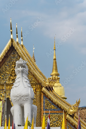 Viharn Luang and the golden dome of Chedi Phrathatluang in the Wat Phra Singh Temple in Chiang Mai, Thailand photo