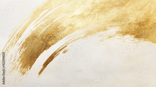 Golden brush strokes on a Japanese paper background, highlighting the delicate balance of color and texture in a minimalist design. photo