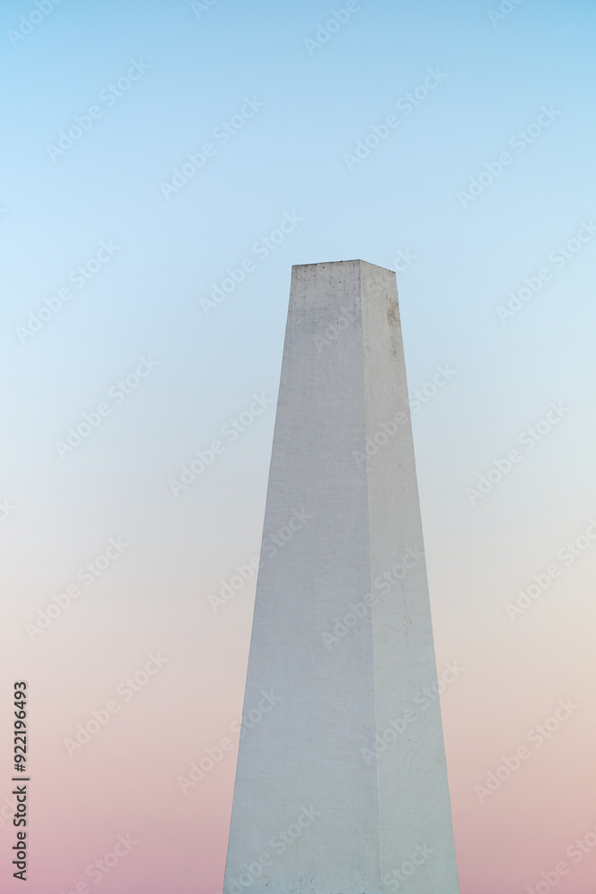 Minimalist White Chimney of a fish smokery against a Pastel Sky at Dusk on Building in the danish city Allinge on the island of Bornholm Minimalist White Chimney of a fish smokery against a Pastel Sky at Dusk on Building in the danish city Allinge on the island of Bornholm