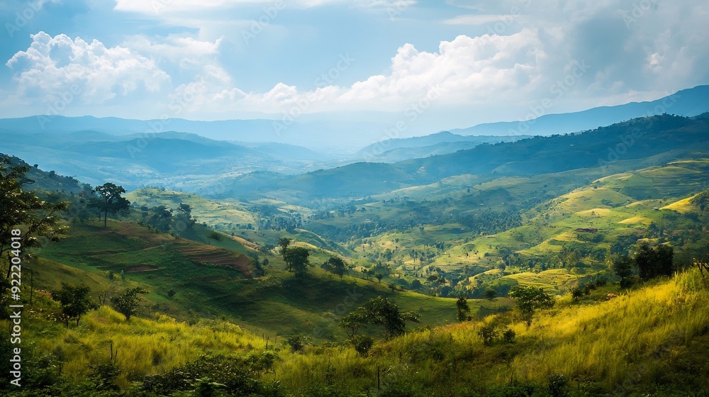 Fototapeta premium Scenic View of Rolling Green Hills and Blue Sky