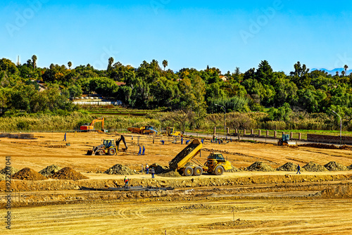 Earthmoving machinery on large construction site on the outskirts of Oudtshoorn, Western Cape, South Africa photo