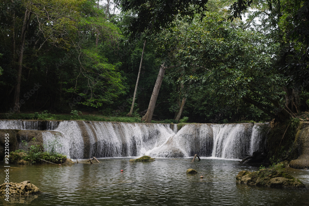 Fototapeta premium The beautiful waterfall named Namtok Chet Sao Noi is located in Saraburi province in central Thailand. It is popular among the local residents.