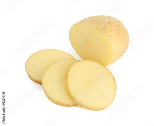 Fresh whole and cut potatoes isolated on white