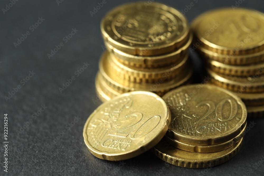 Many euro coins on grey table, closeup. Space for text Many euro coins on grey table, closeup. Space for text