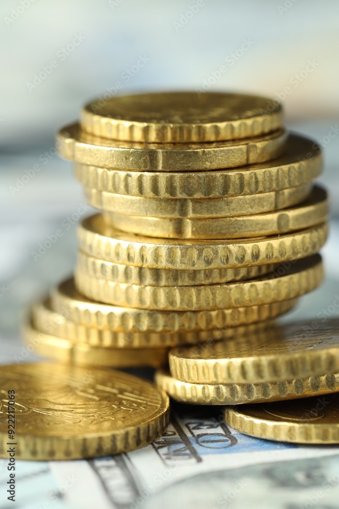 Many euro coins on dollar banknotes, closeup Many euro coins on dollar banknotes, closeup