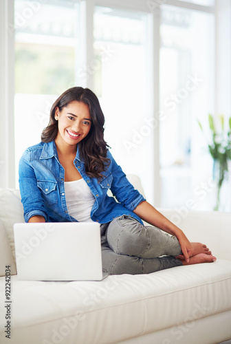 Free Download Laptop, happy woman and portrait in home to relax on sofa for remote work, online blog or news. Computer, freelancer and girl smile in living room for research, data entry and information on internet - GFXLoad