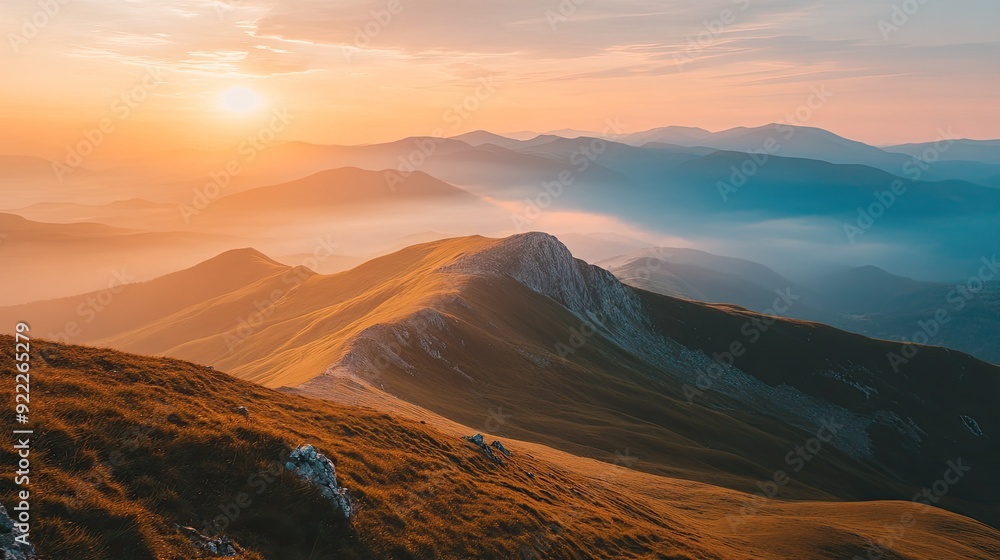 Panoramic top view of a mountain range at sunset, with ample space for text in the sky Panoramic top view of a mountain range at sunset, with ample space for text in the sky