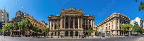 Stunning panoramic view of historic buildings under a clear blue sky, showcasing architectural beauty and urban charm.