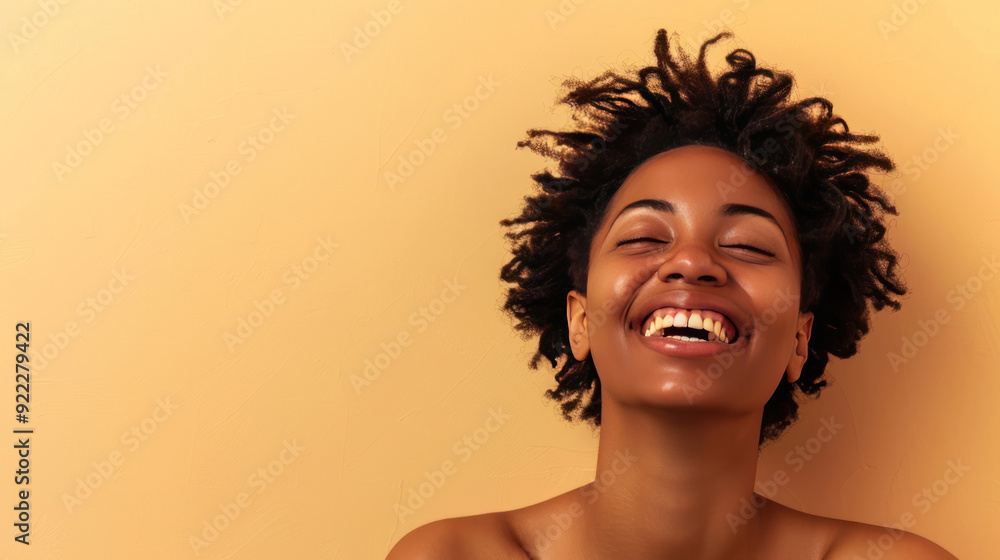 Portrait of a carefree laughing woman enjoying a spa treatment, bare shoulders, on a beige background Portrait of a carefree laughing woman enjoying a spa treatment, bare shoulders, on a beige background
