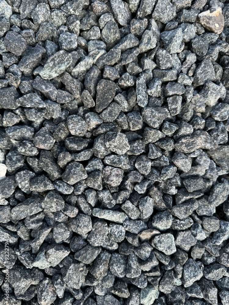 Crushed grey stone on the ground texture background Crushed grey stone on the ground texture background