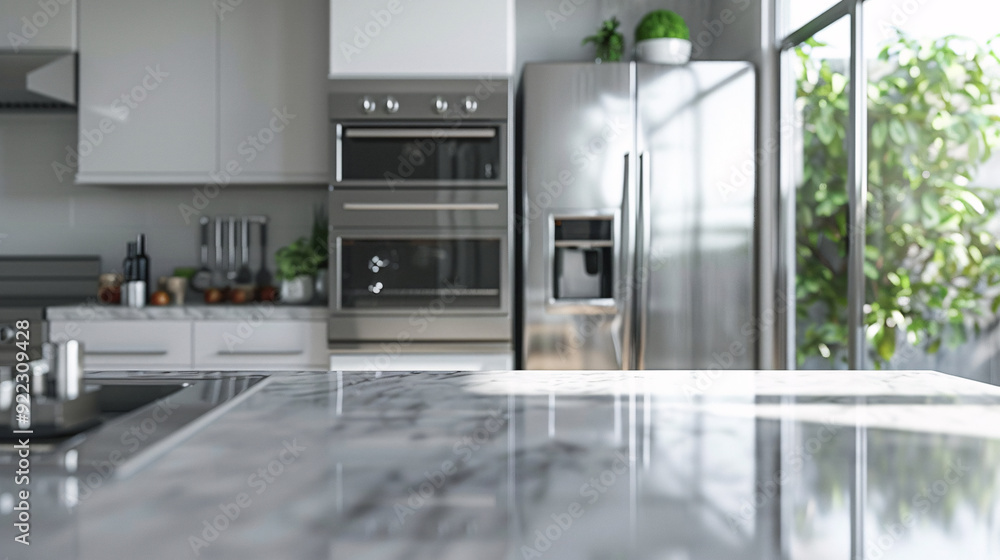 A clean, modern kitchen countertop with a blurred background of stainless steel appliances, white cabinets, and a window with a view of greenery. The sleek design and natural light create a sense of A clean, modern kitchen countertop with a blurred background of stainless steel appliances, white cabinets, and a window with a view of greenery. The sleek design and natural light create a sense of