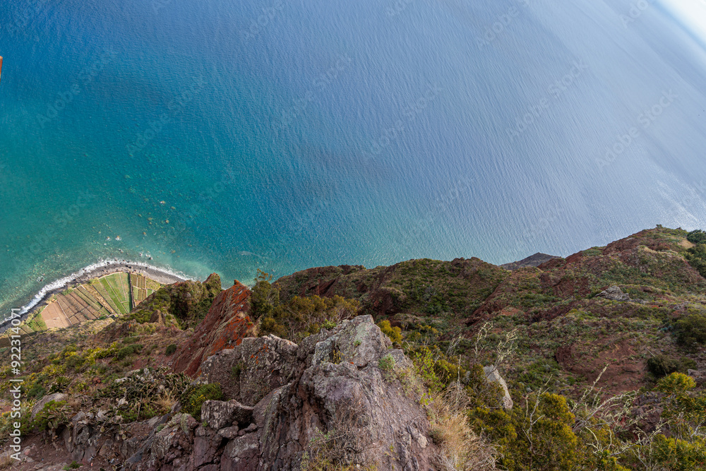 View of the ocean and coastline from the glass-floored Cabo Girao lookout on Madeira Island