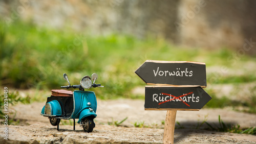 Fotografie Signposts the direct way to forward versus backward