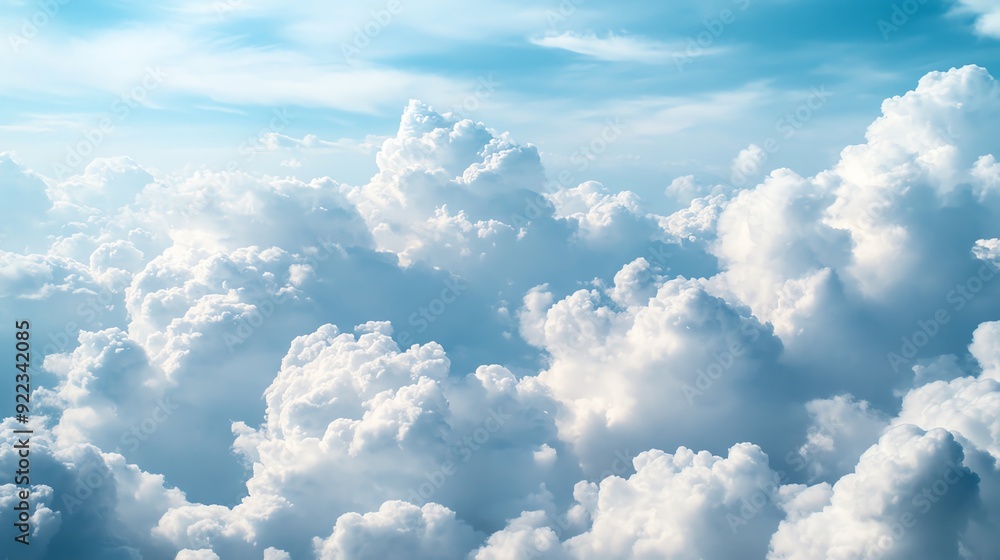 Continuous sky with billowy cumulus clouds, varying shades of blue, topdown view, bright sunlight Continuous sky with billowy cumulus clouds, varying shades of blue, topdown view, bright sunlight