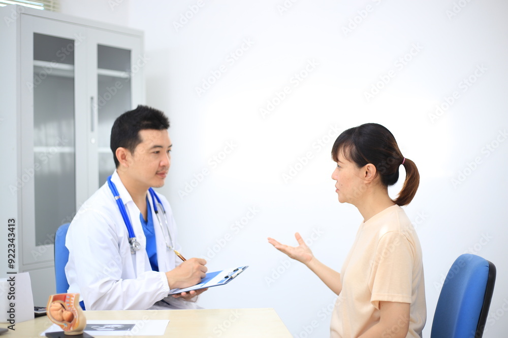 Male doctor with experience examining young pregnant women Male doctor with experience examining young pregnant women