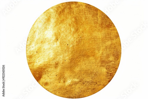 Circular gold-toned metal plate with scratches and texture. photo