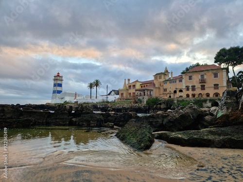 Lighthouse in the beautiful village of Cascais, where the ocean meets the Tagus River. Santa Marta lighthouse museum  photo