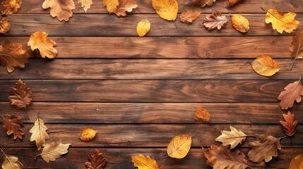 Brown wooden table top view with yellow autumn leaves on the edges and empty copy space for text or design high quality