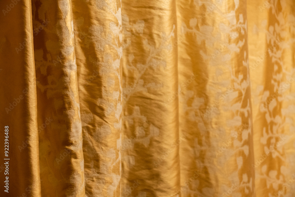 Golden curtain with floral pattern background