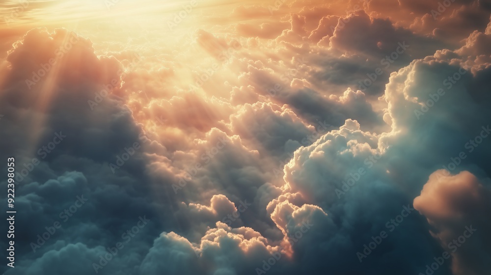 Fototapeta premium A stunning view of the clouds from above, with rays shining through them.