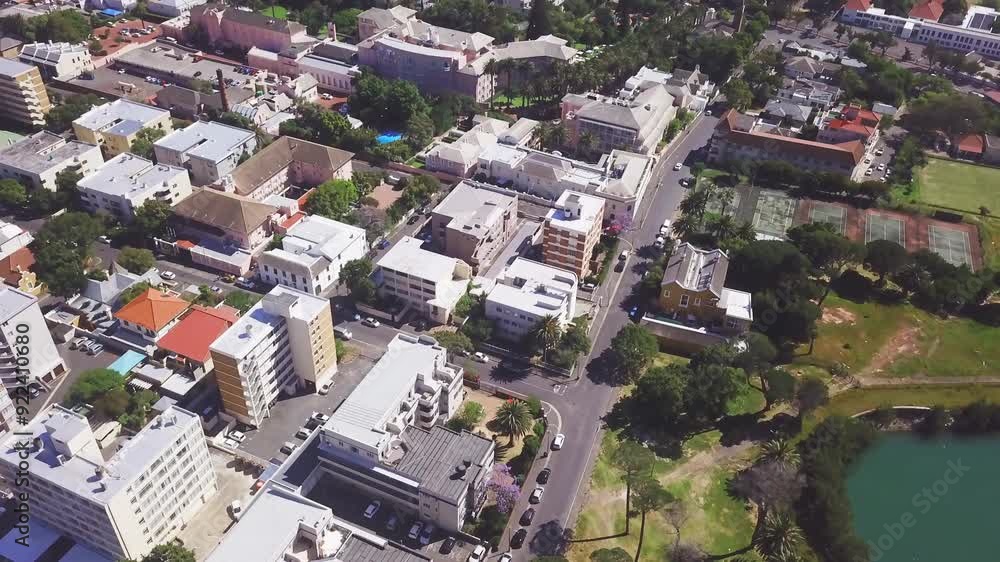 Drone of houses, buildings and neighborhood with green park, road and street for urban development in architecture. Aerial view of residential home, rooftop and transport, landscape or infrastructure Drone of houses, buildings and neighborhood with green park, road and street for urban development in architecture. Aerial view of residential home, rooftop and transport, landscape or infrastructure