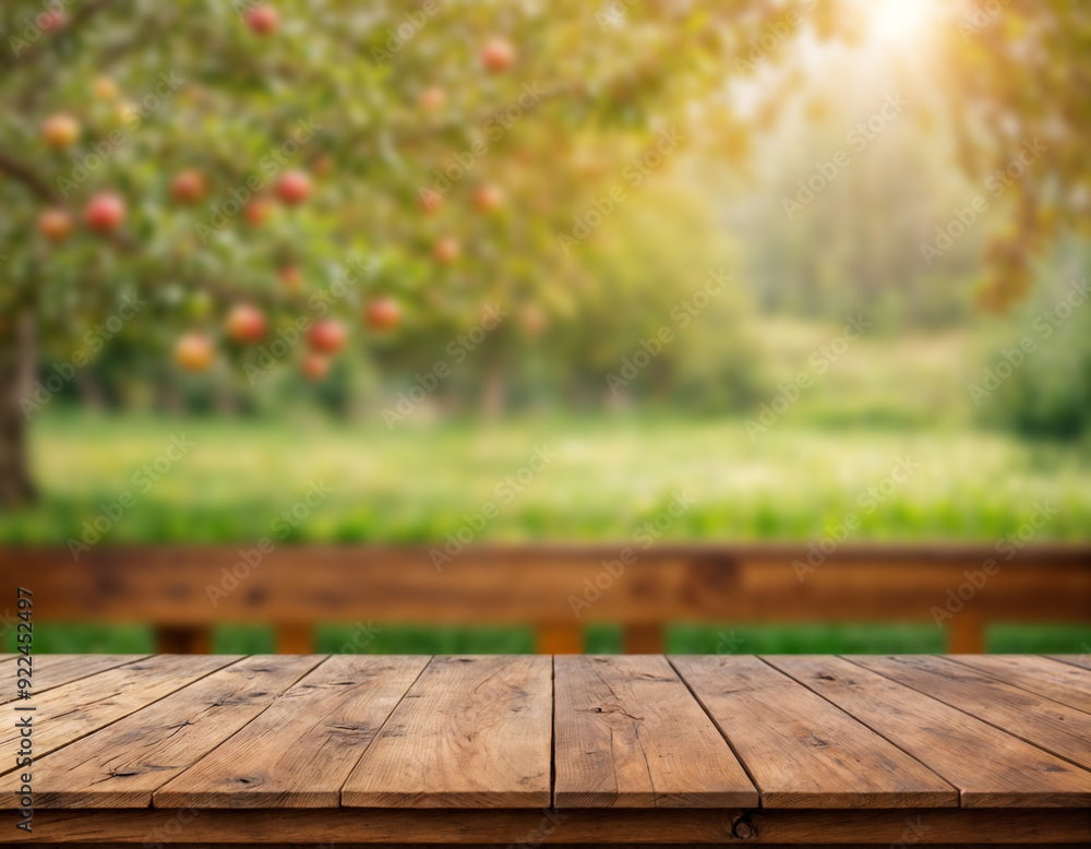 Apple tree background, wooden table top on super blurred background. used for display or wooden montage as your dining background. banners, boards, podiums Apple tree background, wooden table top on super blurred background. used for display or wooden montage as your dining background. banners, boards, podiums