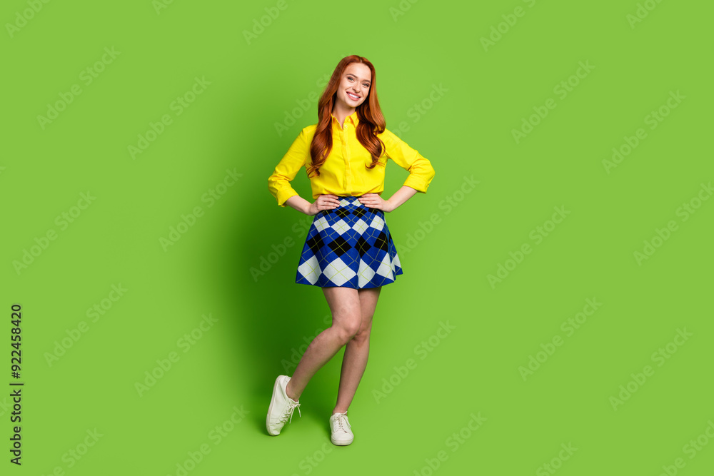 Full body photo of attractive young woman posing model dressed stylish yellow clothes isolated on green color background Full body photo of attractive young woman posing model dressed stylish yellow clothes isolated on green color background