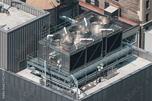 Cuadro en lienzo A large industrial building with a large cooling tower on top